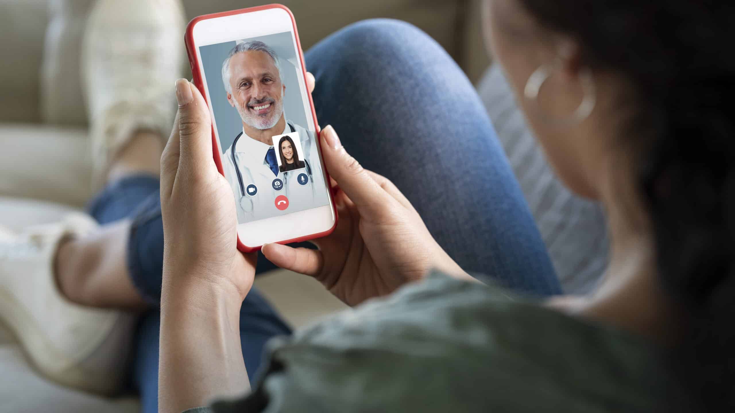 Young woman using smartphone for video call